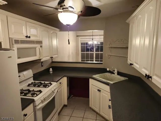 a kitchen with a stove and a sink