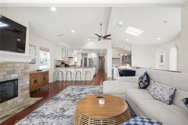 a large kitchen with a table and chairs