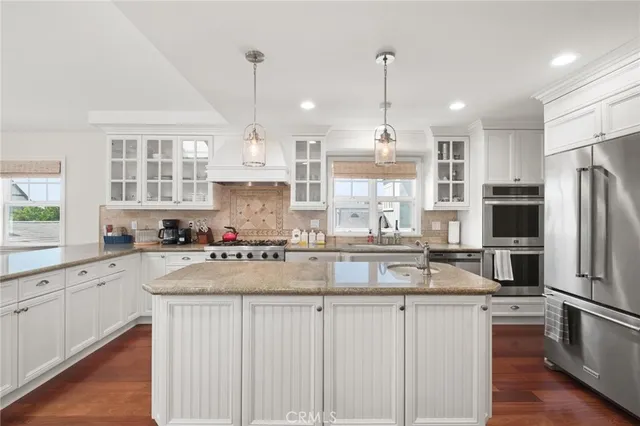 a kitchen with lots of counter top space and appliances