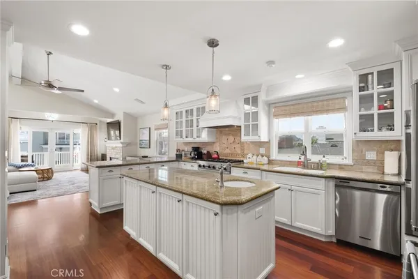 a kitchen with center island table and chairs