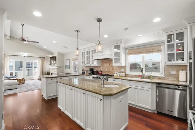 a kitchen with center island table and chairs