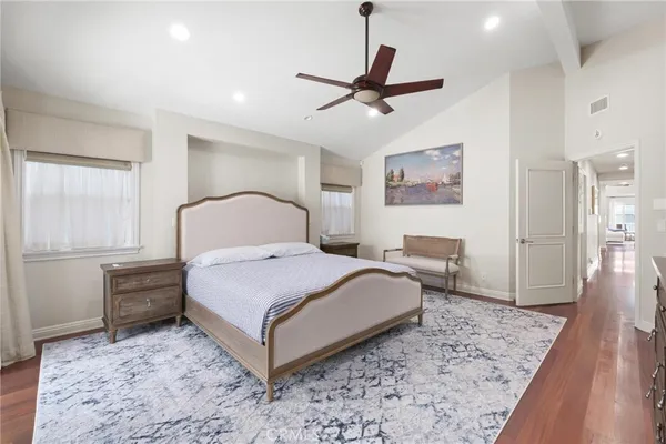 a bathroom with a bathtub a double vanity sink and mirror