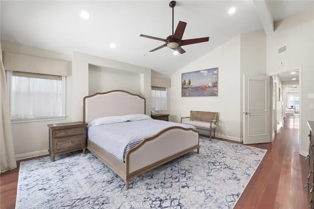 a bathroom with a bathtub a double vanity sink and mirror