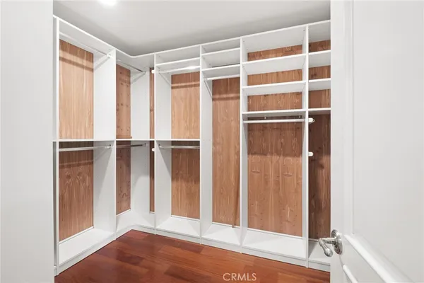 a bathroom with a granite countertop tub sink shower and mirror