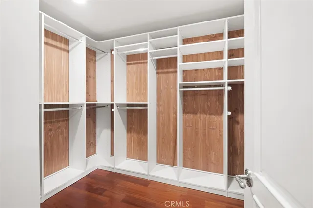 a bathroom with a granite countertop tub sink shower and mirror