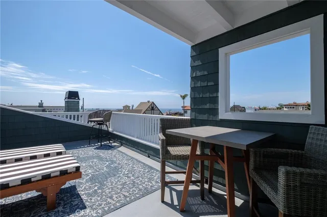 a view of balcony with furniture