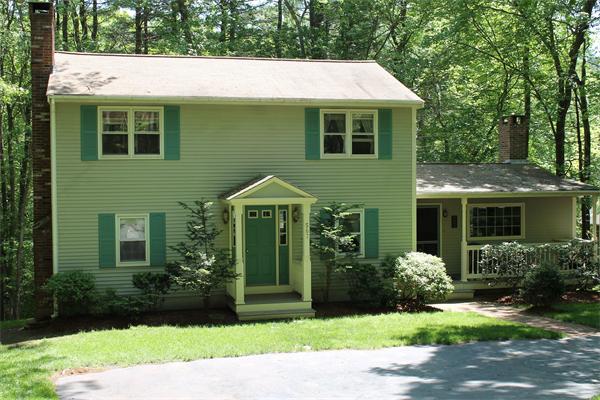 567 Fowler Road Northbridge, MA 01534 - Photo 2 of 22 a front view of a house with a garden