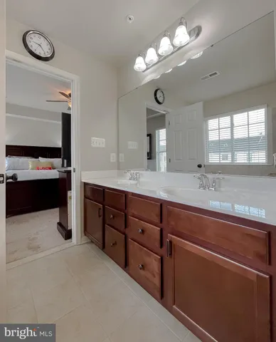 a view of a livingroom with workspace and a window