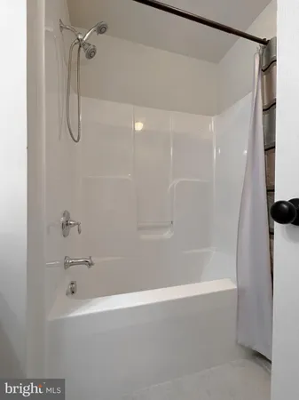 a bathroom with a shower and a toilet