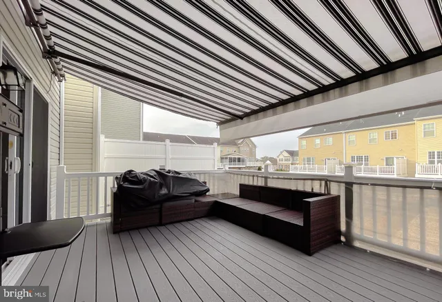 a view of a livingroom with furniture and a window