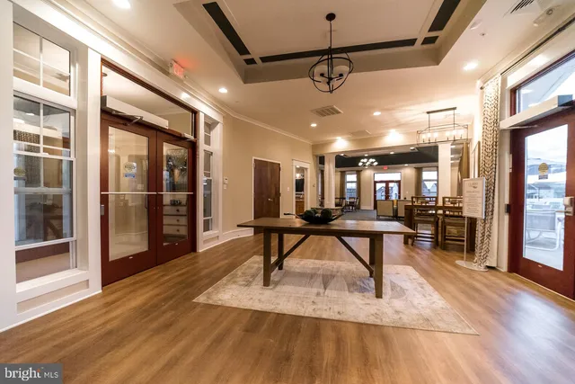 a view of a terrace with a table and chairs