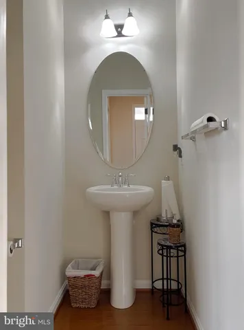 a kitchen with stainless steel appliances granite countertop a stove a refrigerator a kitchen island a dining table and chairs