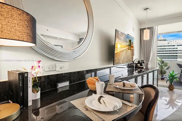 a dining room with furniture and wooden floor