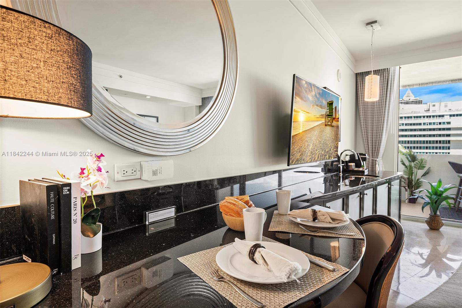 4391 Collins Avenue, Unit 802 Miami Beach, FL 33140 - Photo 12 of 39 a dining room with furniture and wooden floor