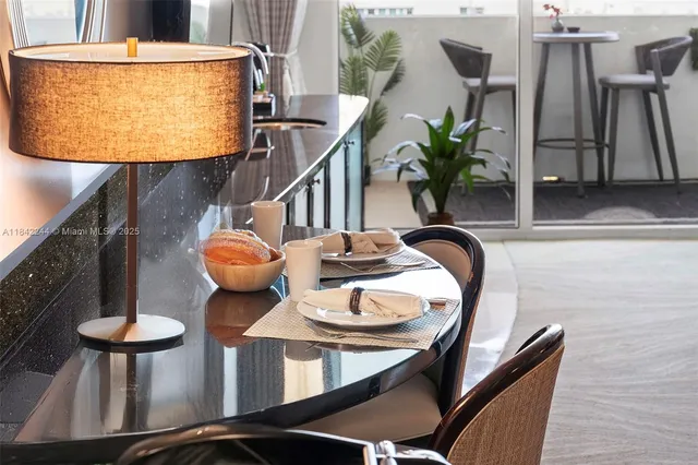 a dining room with furniture and wooden floor