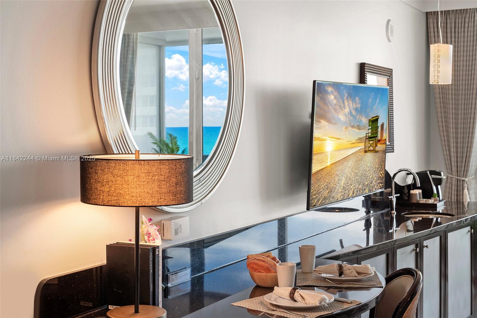 4391 Collins Avenue, Unit 802 Miami Beach, FL 33140 - Photo 15 of 39 a room with furniture and wooden floor