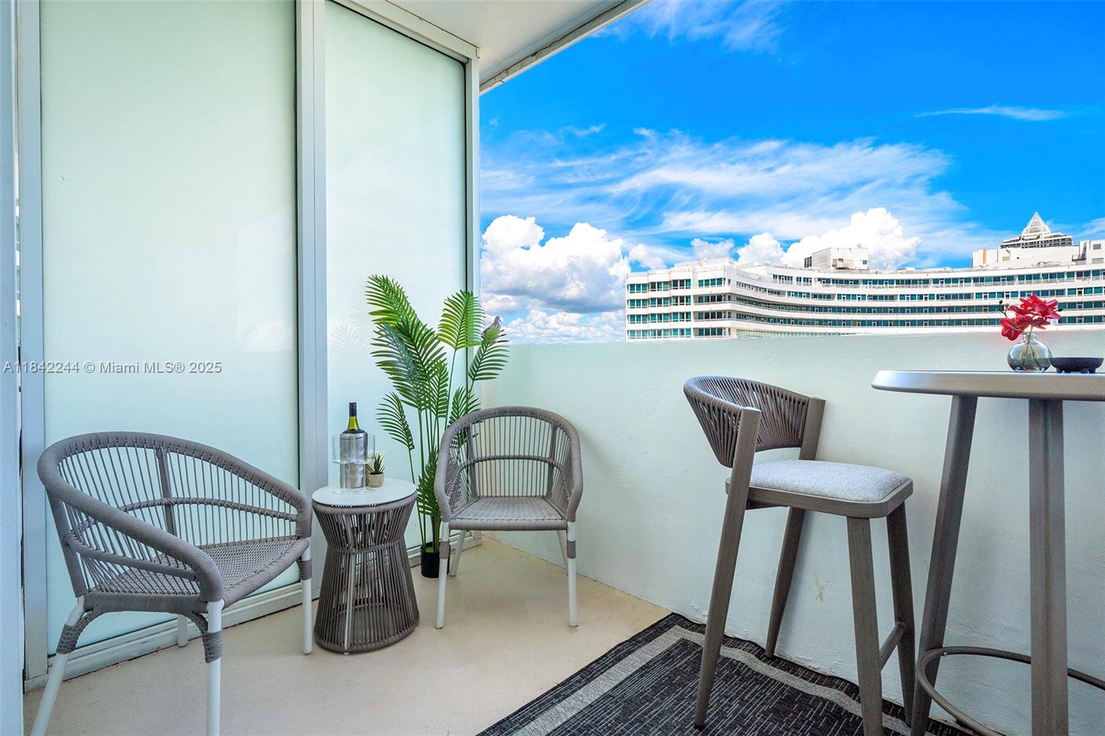 4391 Collins Avenue, Unit 802 Miami Beach, FL 33140 - Photo 22 of 39 a view of a chair and table