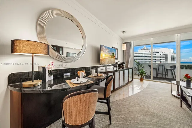 a dining room with furniture and wooden floor