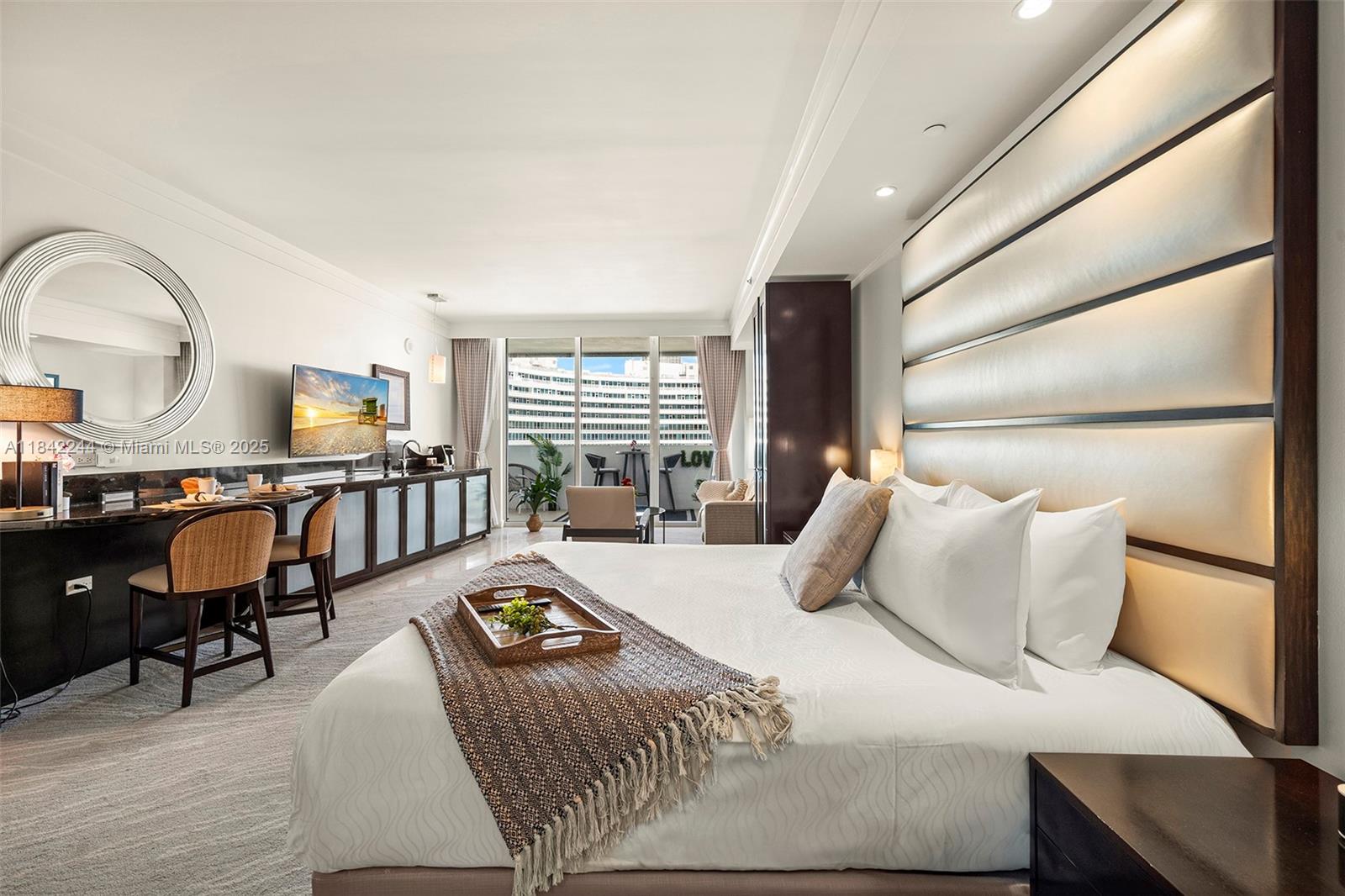 4391 Collins Avenue, Unit 802 Miami Beach, FL 33140 - Photo 31 of 39 a bedroom with furniture and a window