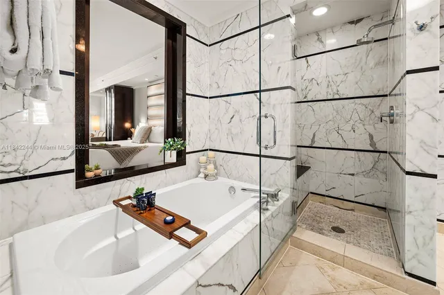 a bathroom with a white bath tub and a sink