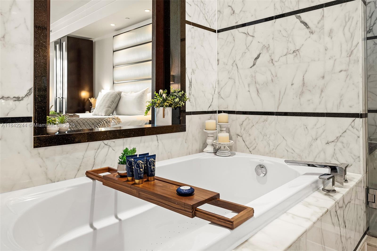 4391 Collins Avenue, Unit 802 Miami Beach, FL 33140 - Photo 33 of 39 a bathroom with a tub and sink