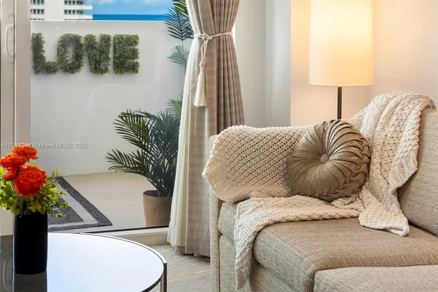 a bedroom with a bed and a potted plant