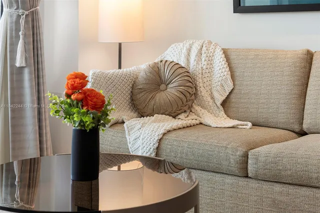 a bedroom with a bed and a potted plant