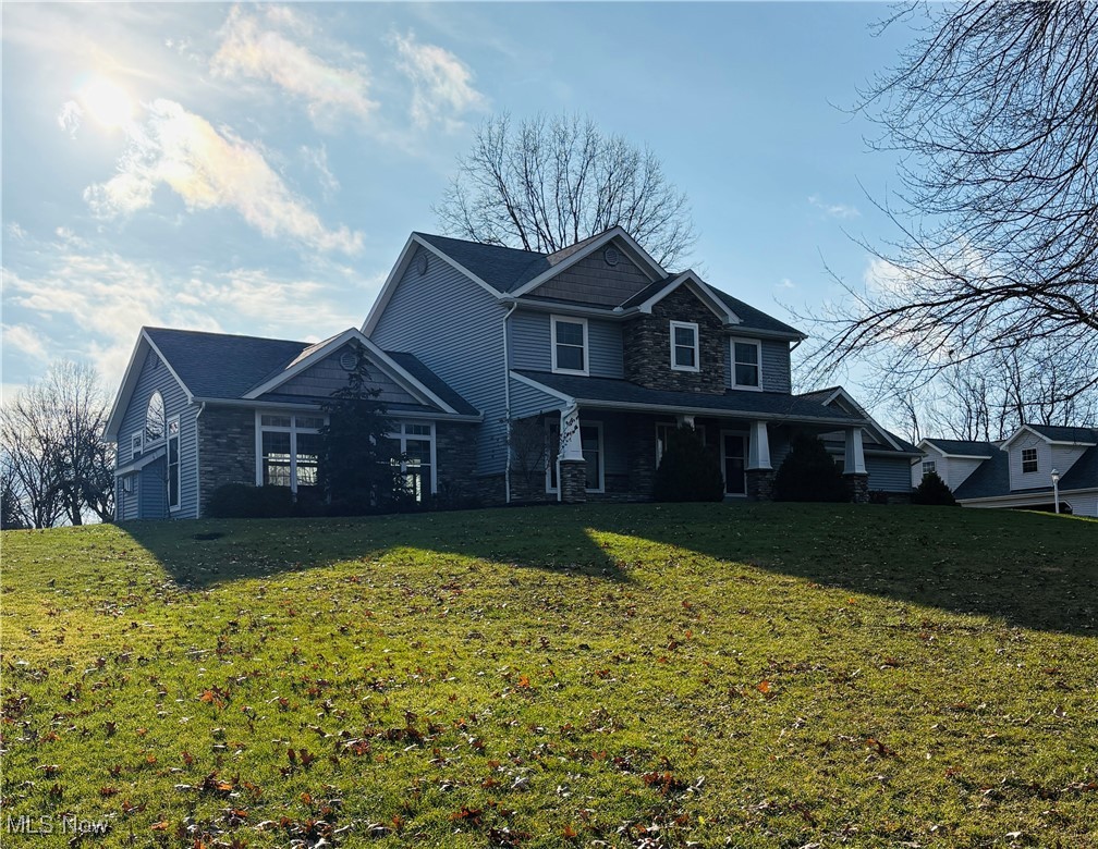 2504 Meloy Road Kent, OH 44240 - Photo 2 of 50 View of front facade with a garage and a front yard