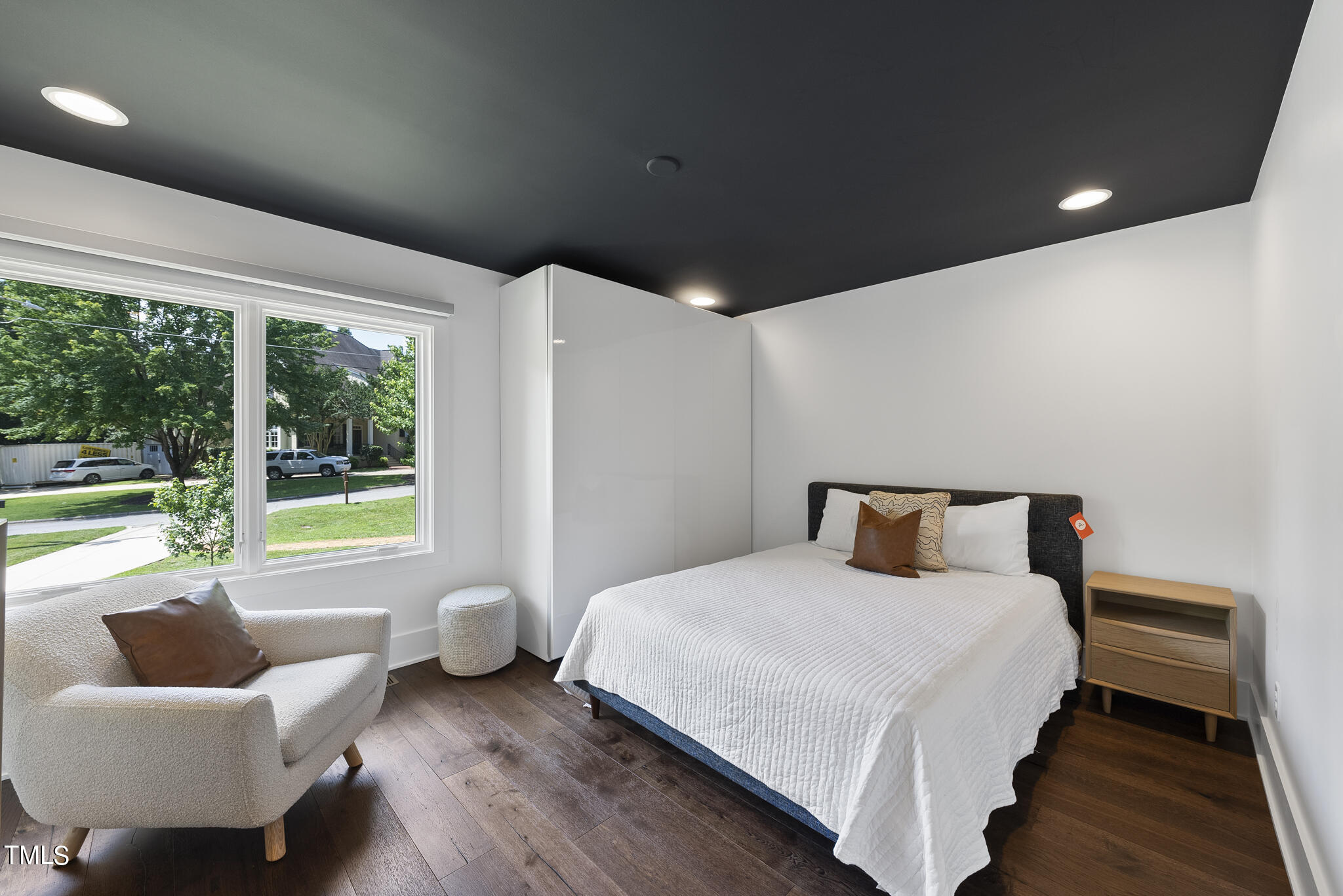 3122 Ashel Street Raleigh, NC 27612 - Photo 12 of 39 a bedroom with a bed and a couch