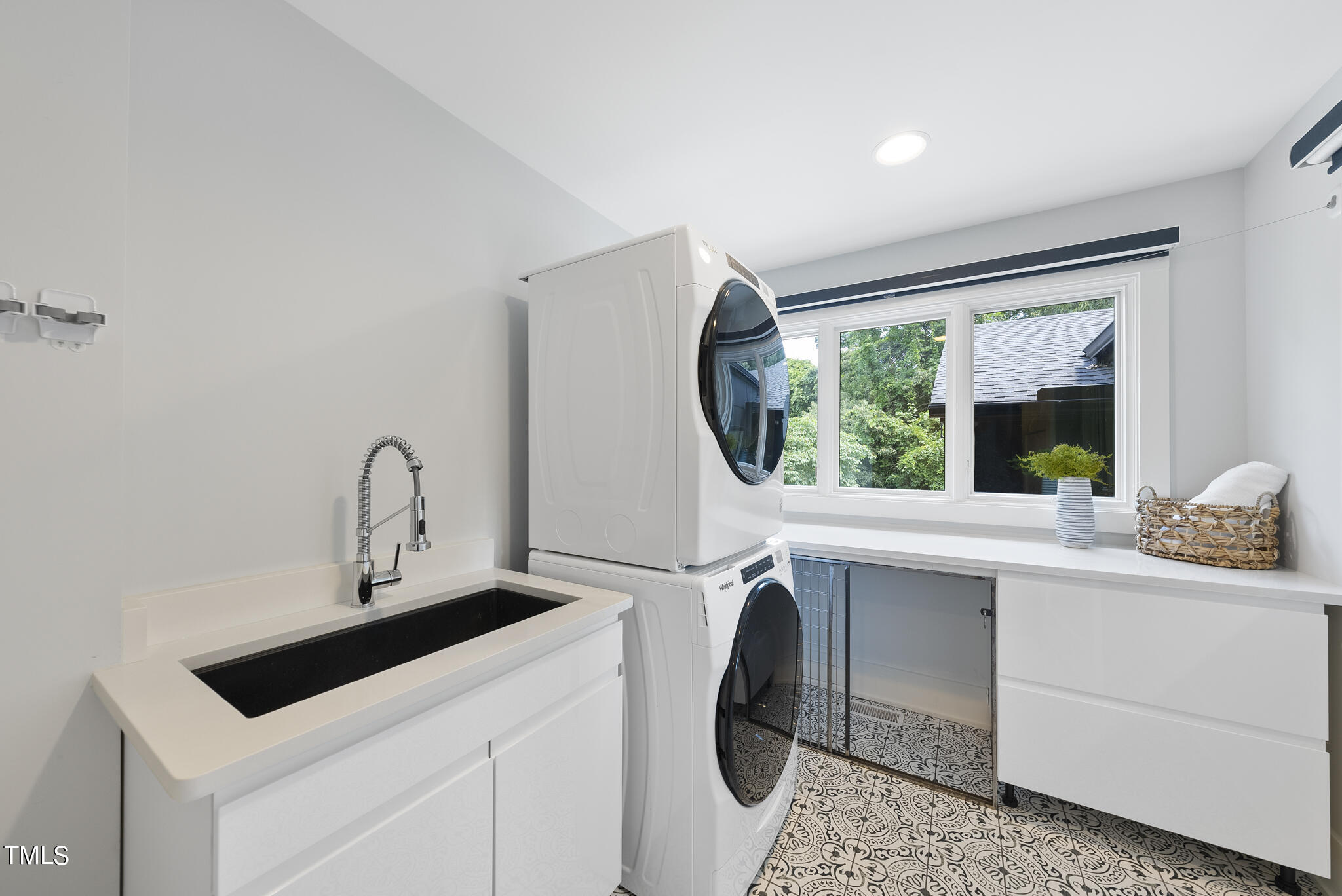 3122 Ashel Street Raleigh, NC 27612 - Photo 26 of 39 a kitchen with a sink cabinets and a window