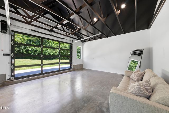 a view of livingroom with furniture and floor to ceiling window