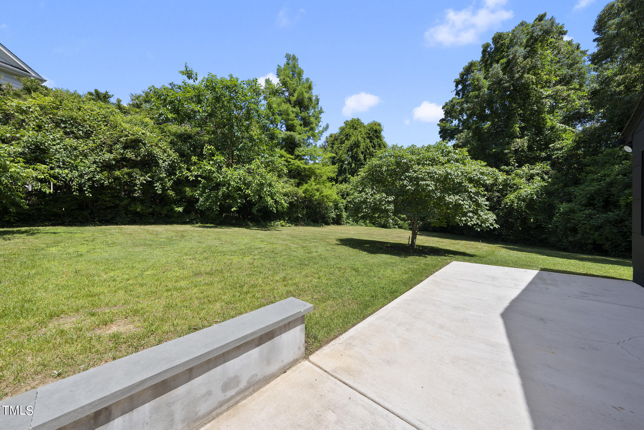 3122 Ashel Street Raleigh, NC 27612 - Photo 34 of 39 a view of a garden with potted plants and large trees