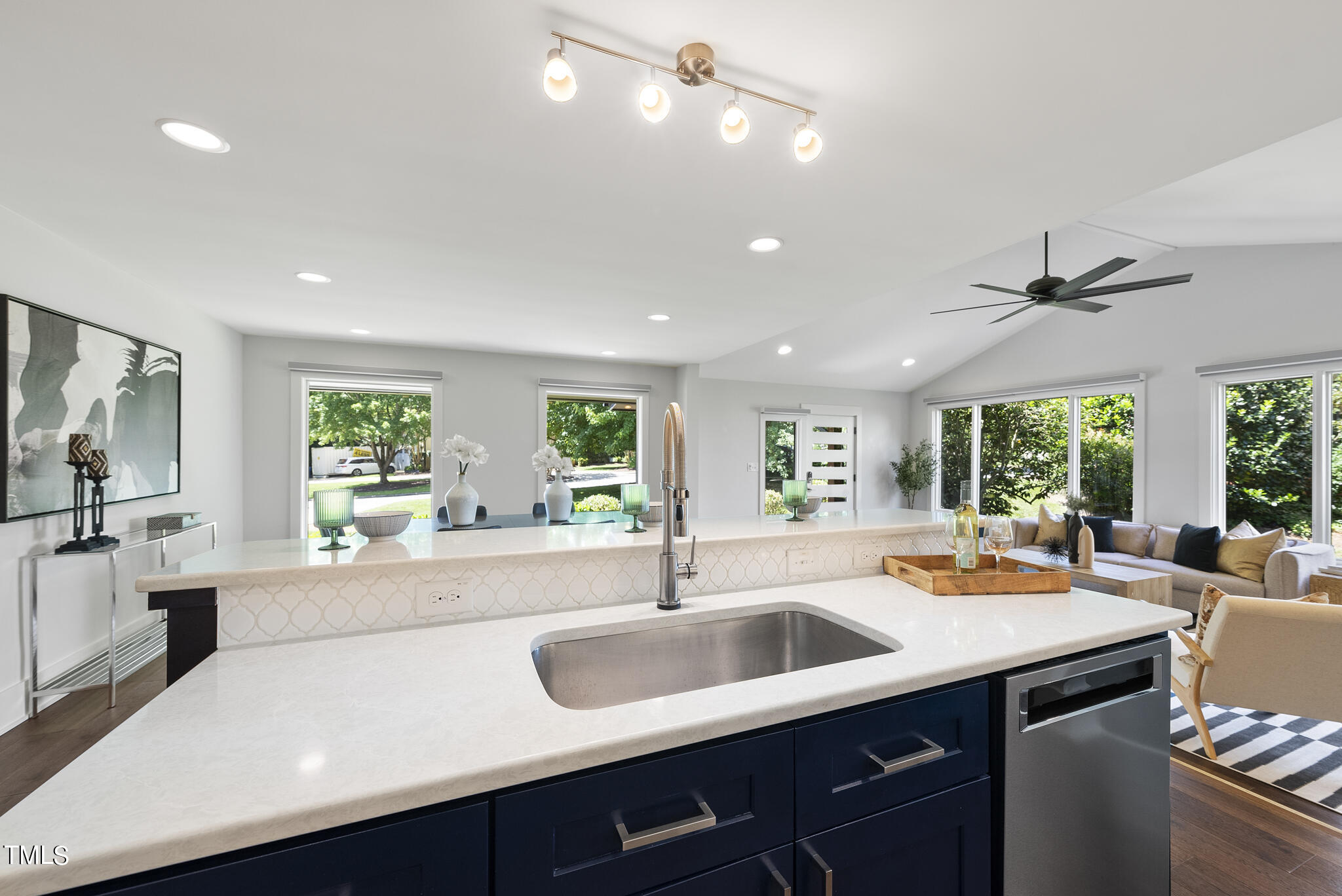 3122 Ashel Street Raleigh, NC 27612 - Photo 10 of 39 a kitchen with center island a sink and a window