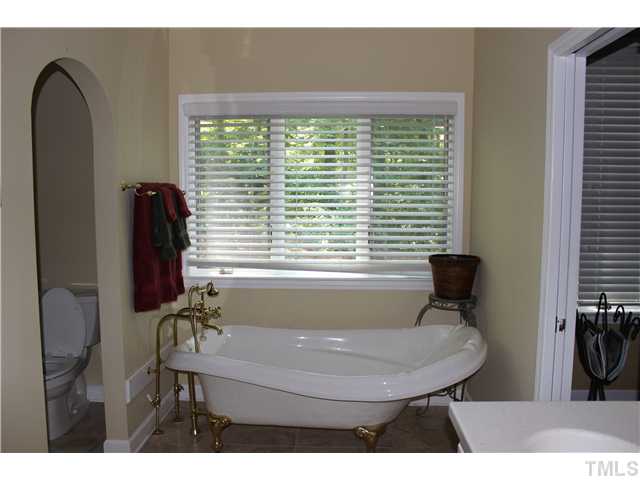 1035 Anglers Way Roxboro, NC 27574 - Photo 11 of 25 Spacious and luxurious Master Bath/Spa with Claw foot tub, Walk in Shower, Private Toilet, Double Sinks and Walk in Closet.