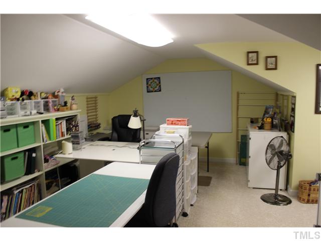 1035 Anglers Way Roxboro, NC 27574 - Photo 19 of 25 Upstairs Bonus area that was used as a quilting room but would make a great game area or teenager/adult retreat. Bonus area has several finished spaces and a half bath upstairs!