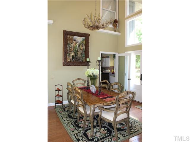 1035 Anglers Way Roxboro, NC 27574 - Photo 5 of 25 Your senses will be delighted when you walk into this breathtaking Dining Room/Foyer featuring soaring ceilings and open view of the Great Room and views of the lake!