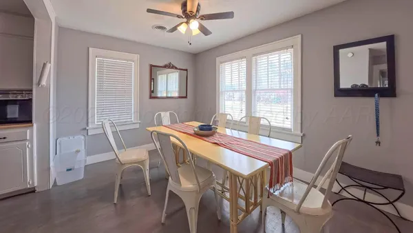 a view of a dining room with furniture and window