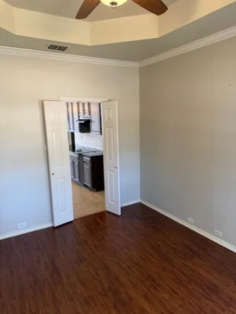 a view of a room with wooden floor and sink