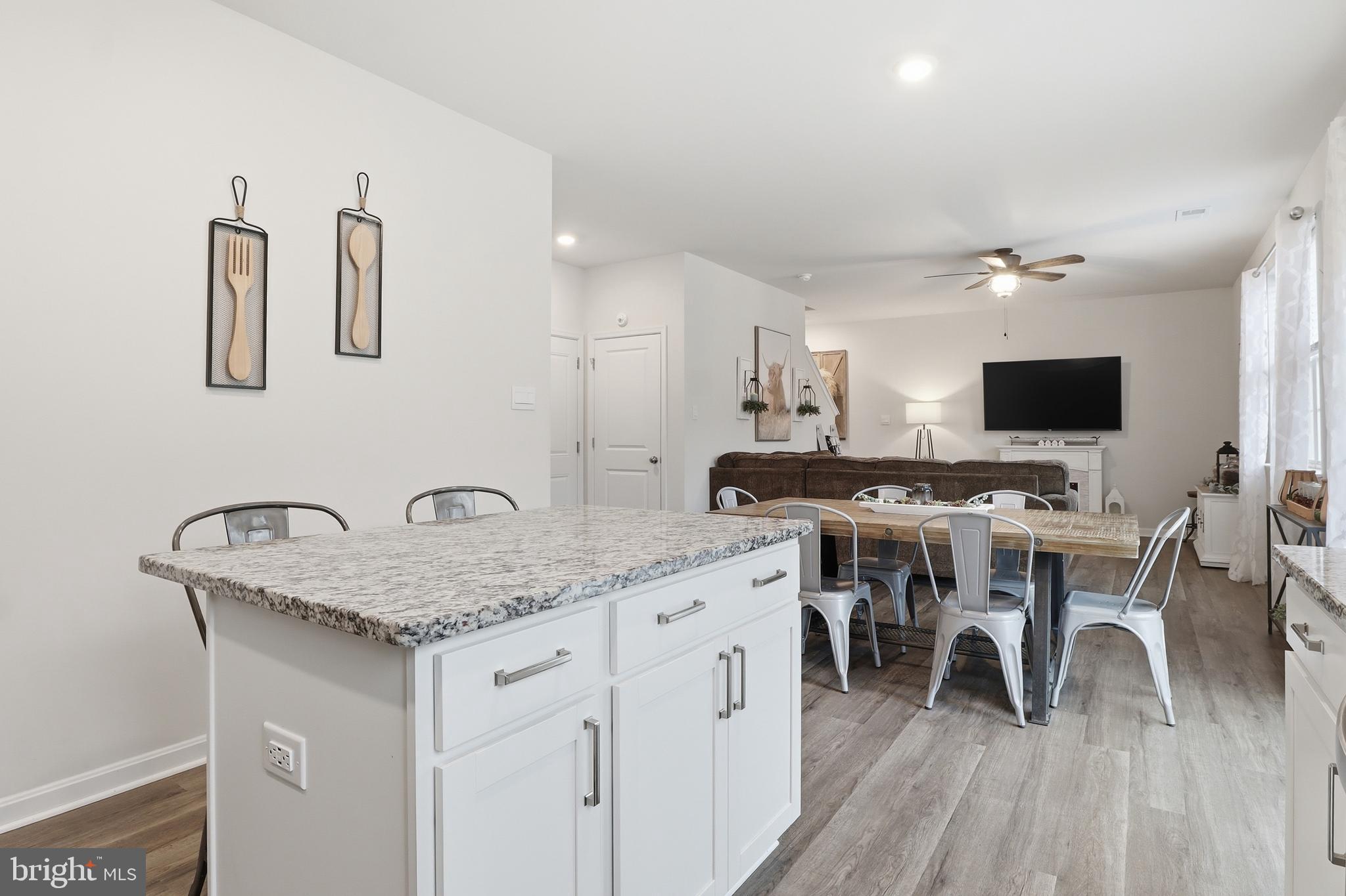 4301 Brent Drive Spring Grove, PA 17362 - Photo 13 of 49 a very nice looking dining room with a large window and wooden floor