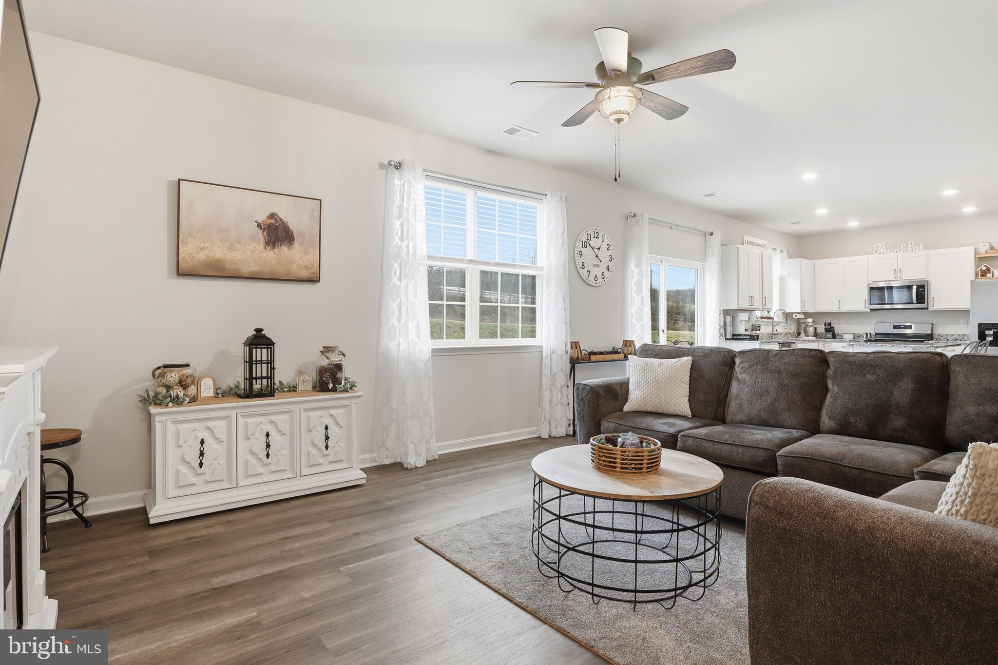 4301 Brent Drive Spring Grove, PA 17362 - Photo 17 of 49 a living room with furniture a dining table and kitchen view