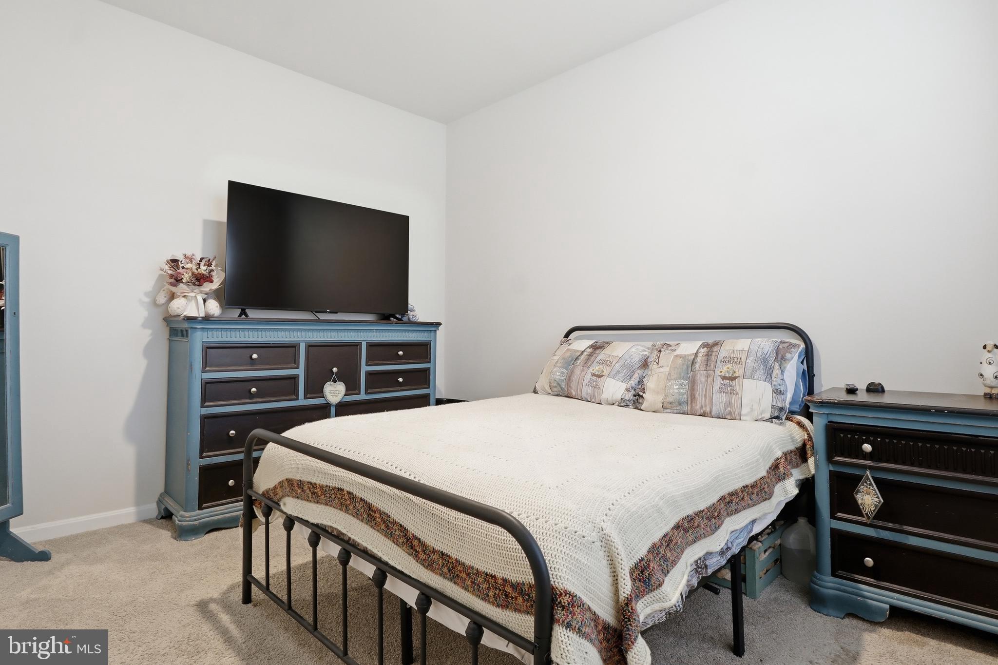 4301 Brent Drive Spring Grove, PA 17362 - Photo 19 of 49 a bedroom with a bed and a flat screen tv