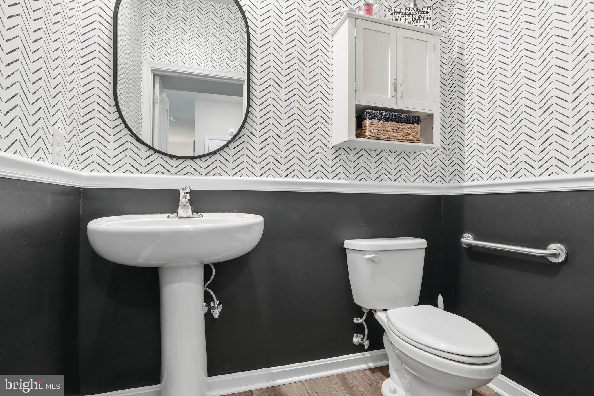 4301 Brent Drive Spring Grove, PA 17362 - Photo 20 of 49 a bathroom with a toilet a sink and mirror