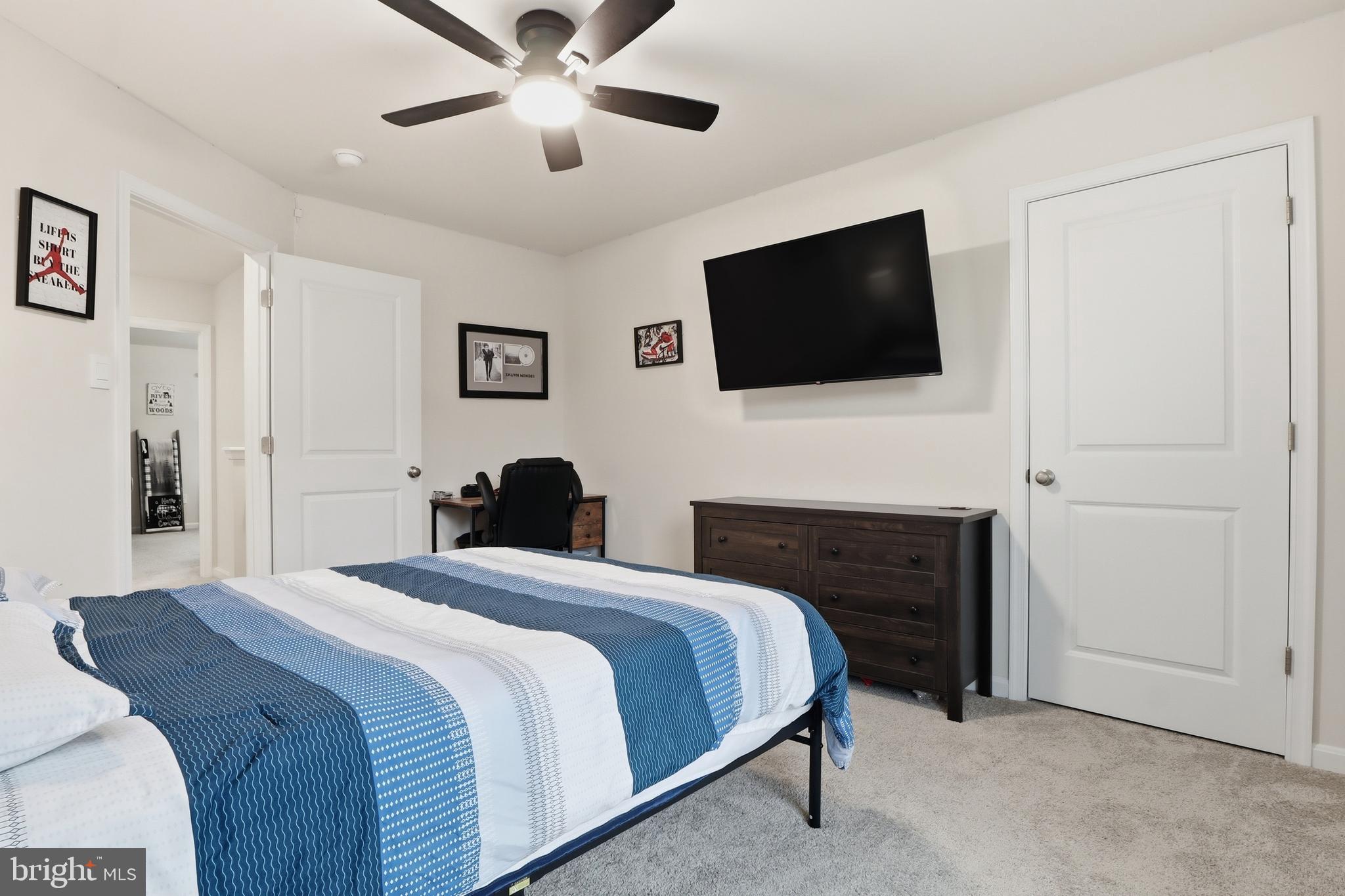 4301 Brent Drive Spring Grove, PA 17362 - Photo 25 of 49 a bedroom with a bed and a flat screen tv