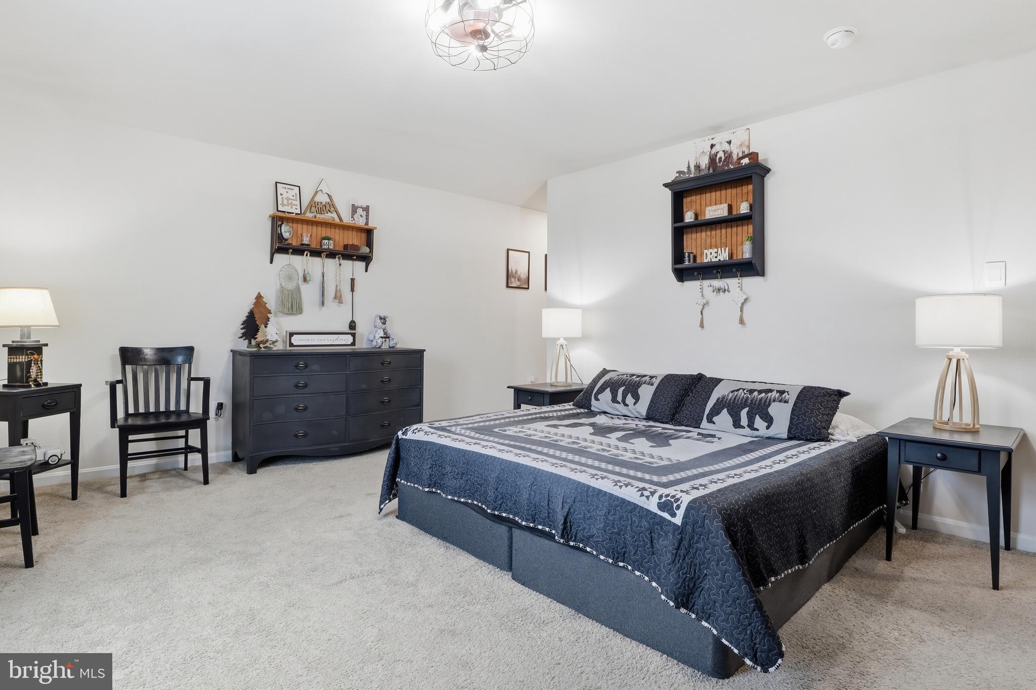 4301 Brent Drive Spring Grove, PA 17362 - Photo 31 of 49 a bedroom with a bed table and chair