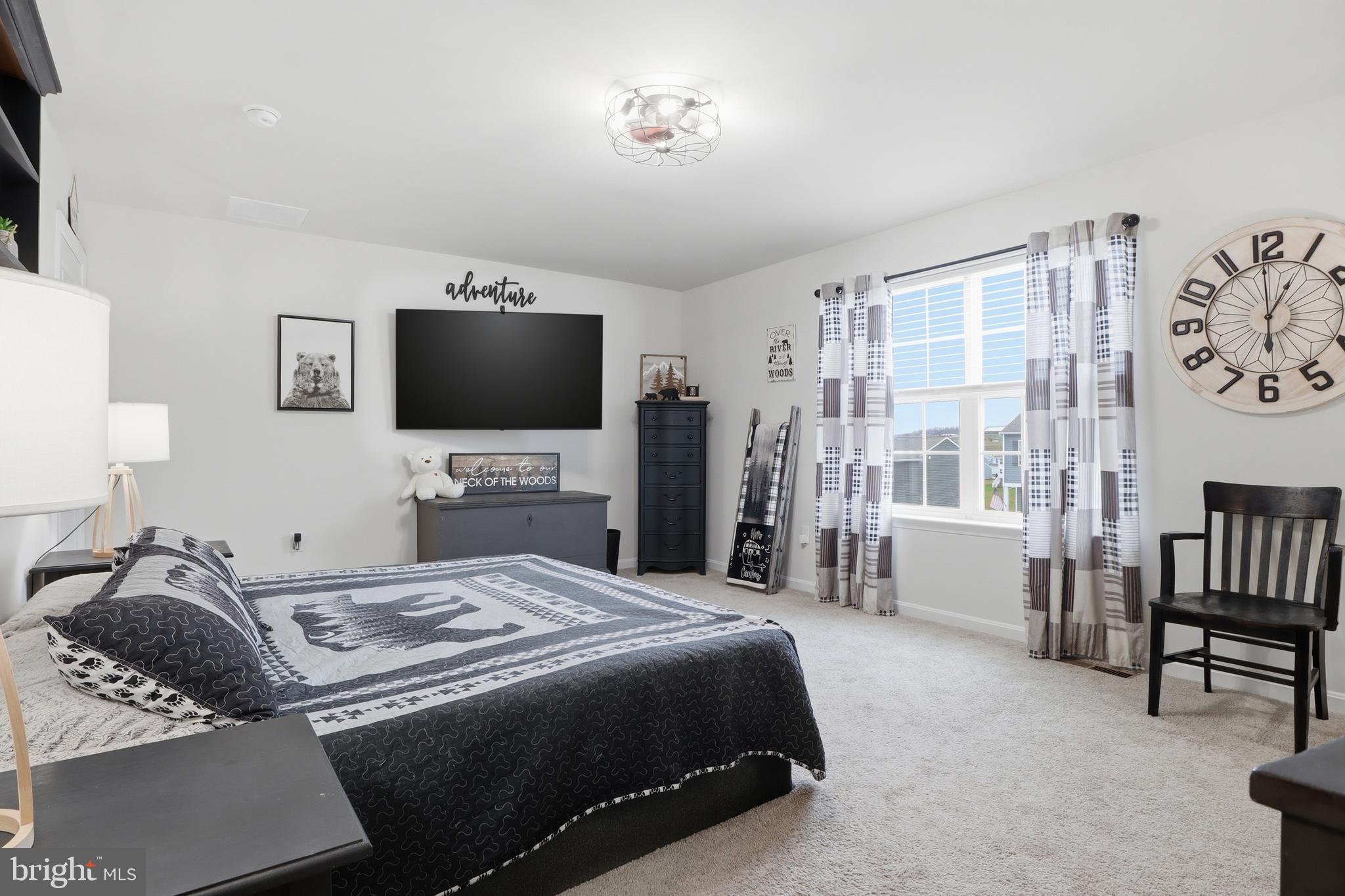 4301 Brent Drive Spring Grove, PA 17362 - Photo 32 of 49 a bedroom with a bed and a flat screen tv