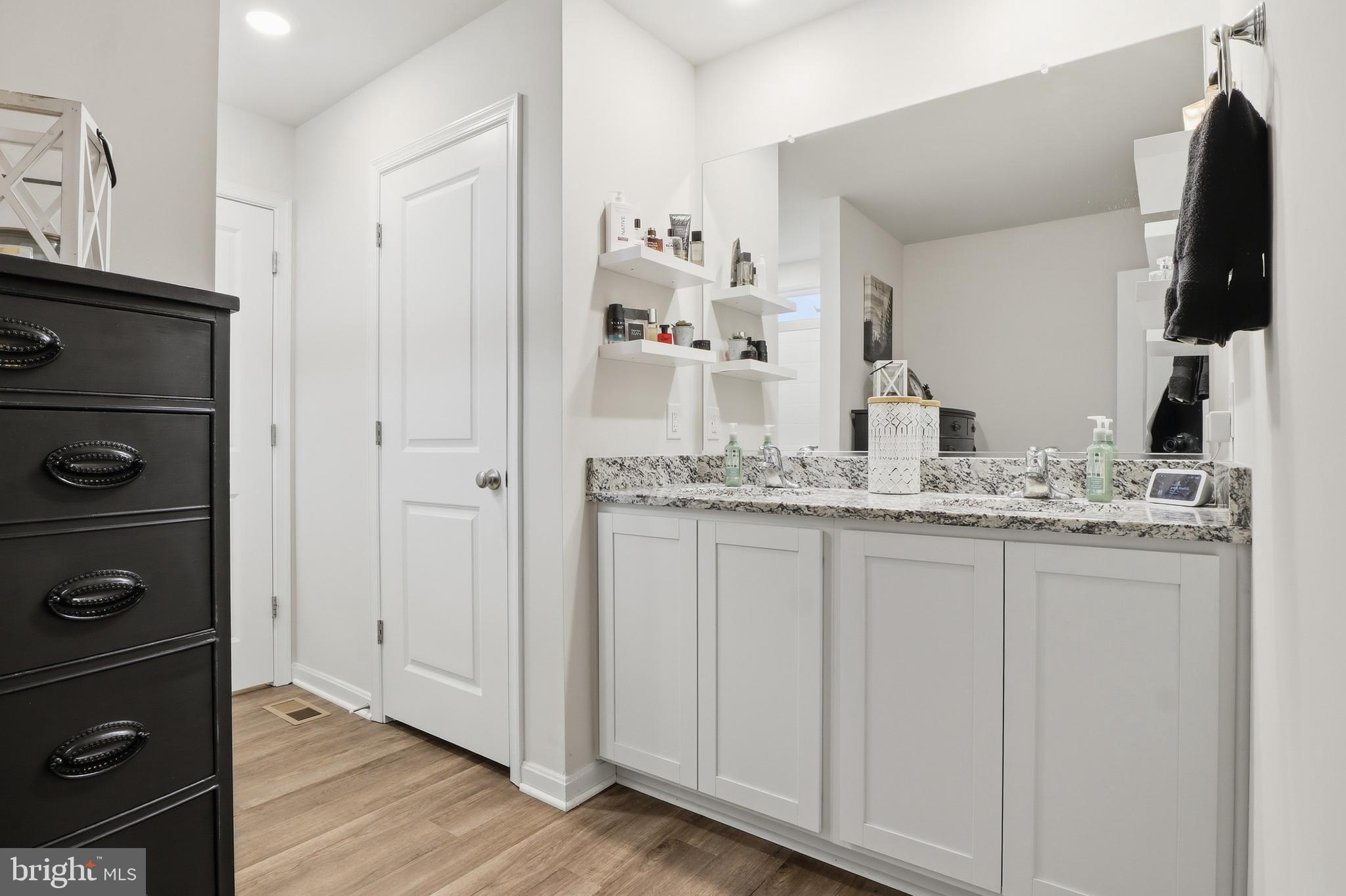 4301 Brent Drive Spring Grove, PA 17362 - Photo 33 of 49 a bathroom with a granite countertop sink and a mirror