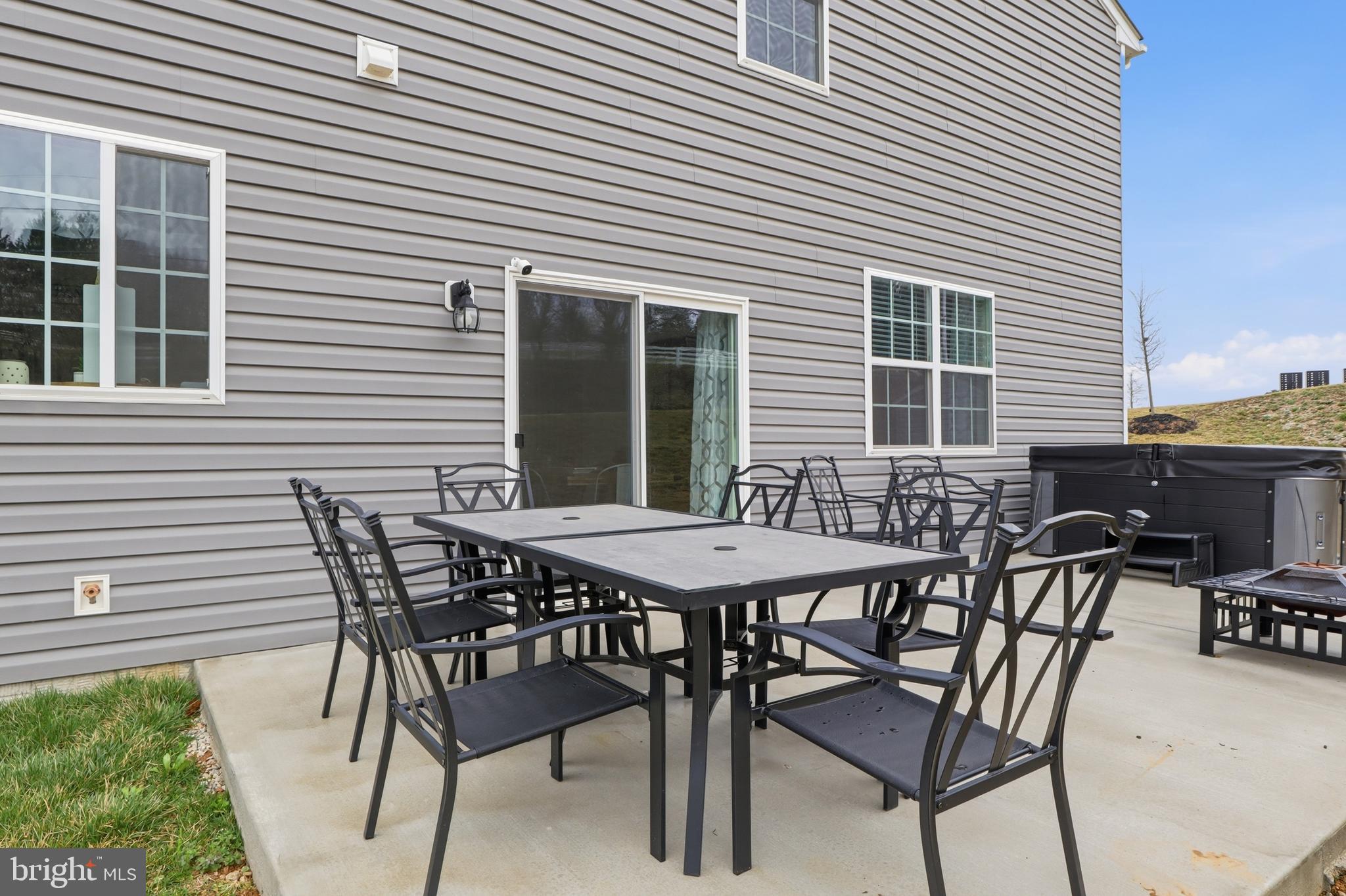 4301 Brent Drive Spring Grove, PA 17362 - Photo 37 of 49 a patio with table and chairs and potted plants