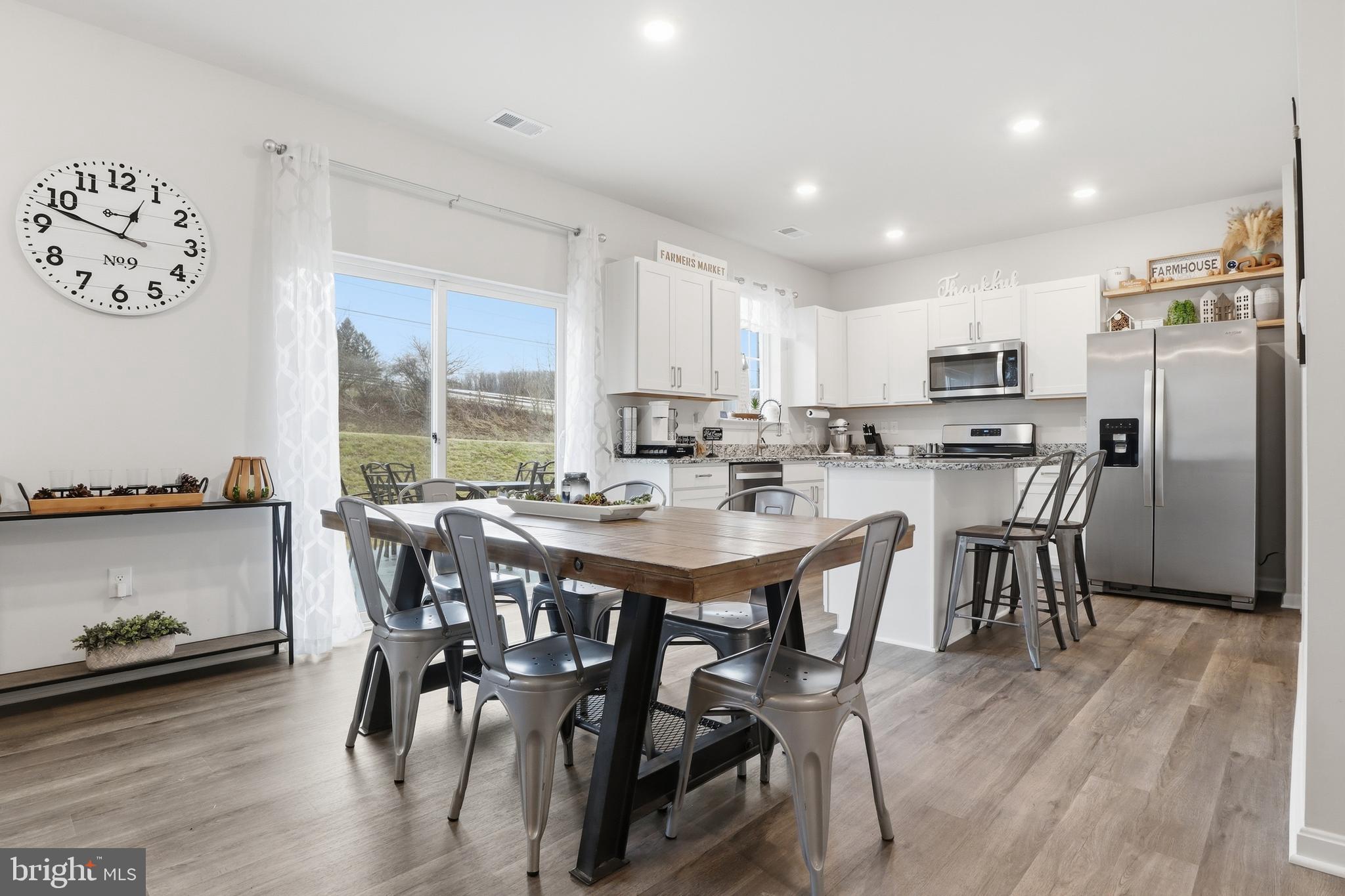 4301 Brent Drive Spring Grove, PA 17362 - Photo 6 of 49 a view of a dining room with furniture and wooden floor
