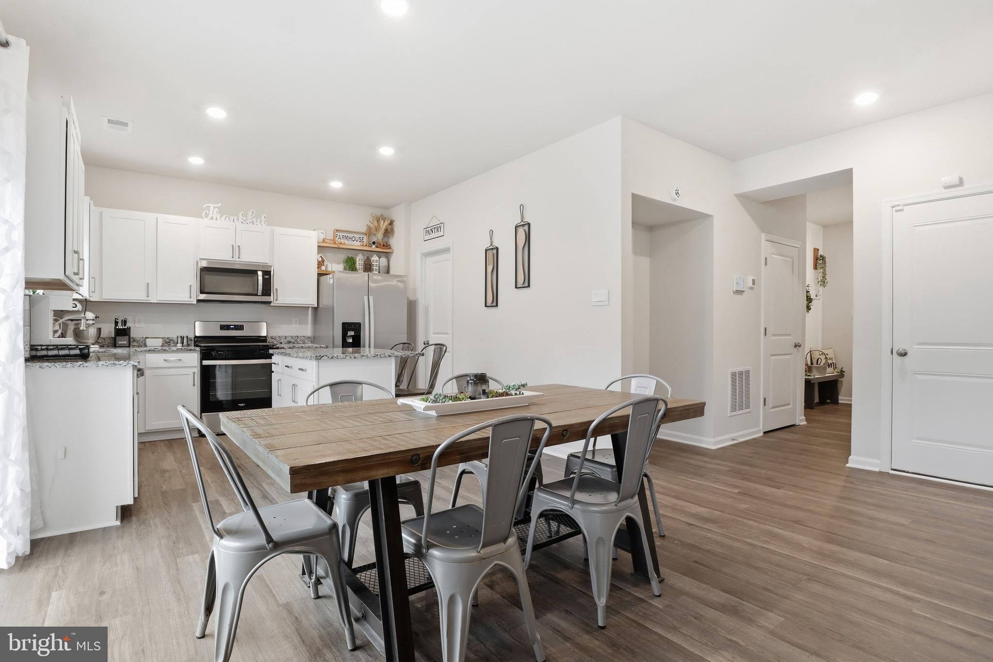 4301 Brent Drive Spring Grove, PA 17362 - Photo 7 of 49 a view of a dining room with furniture and wooden floor