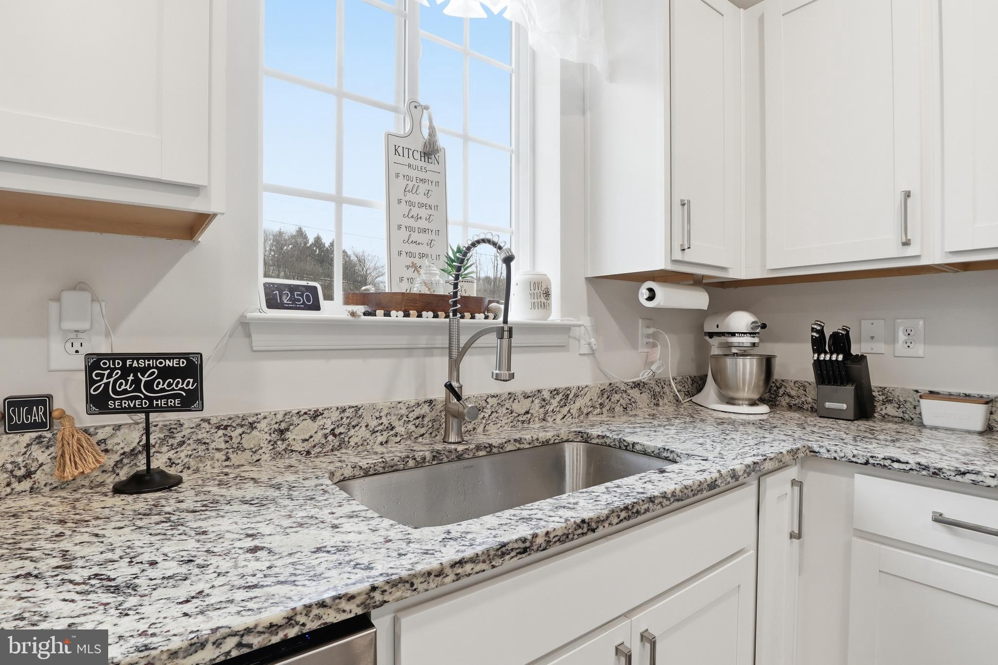 4301 Brent Drive Spring Grove, PA 17362 - Photo 9 of 49 a kitchen with granite countertop a sink a stove and cabinets
